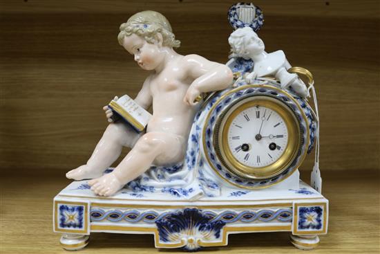 A late 19th century Meissen eight day mantel clock, surmounted by a cherub and objects emblematic of the arts